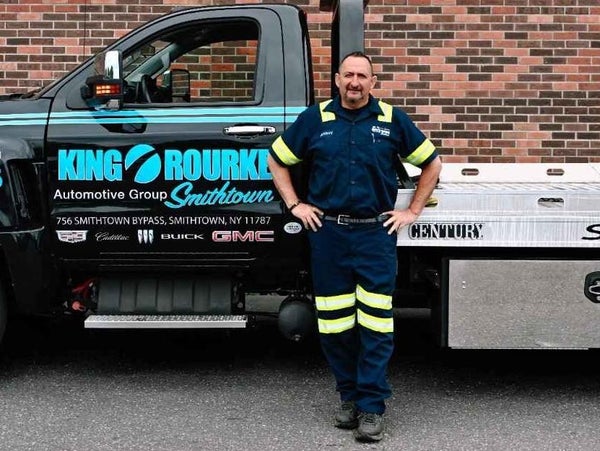 Posing in front of pickup truck